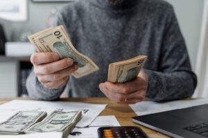 man counting money