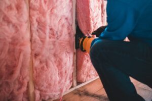 man insulating wall